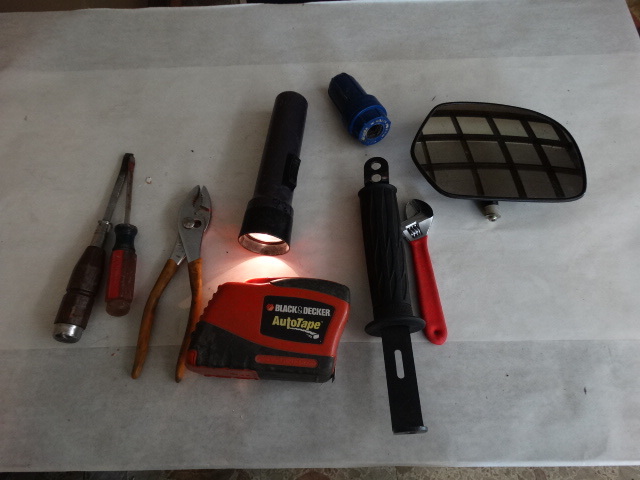 lot 2169 image: Black & Decker Autotape (Cool - Extends And Retracts With Button Push), Stanley Portable Light With USB Charge, Craftsman And Other Screwdriver, Crescent Wrench, Pliers, Flashlight (Lights Up), & More