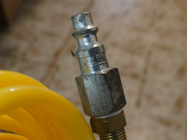 lot 2180 image: Air Hose - Coil Hose With Fittings Installed Already