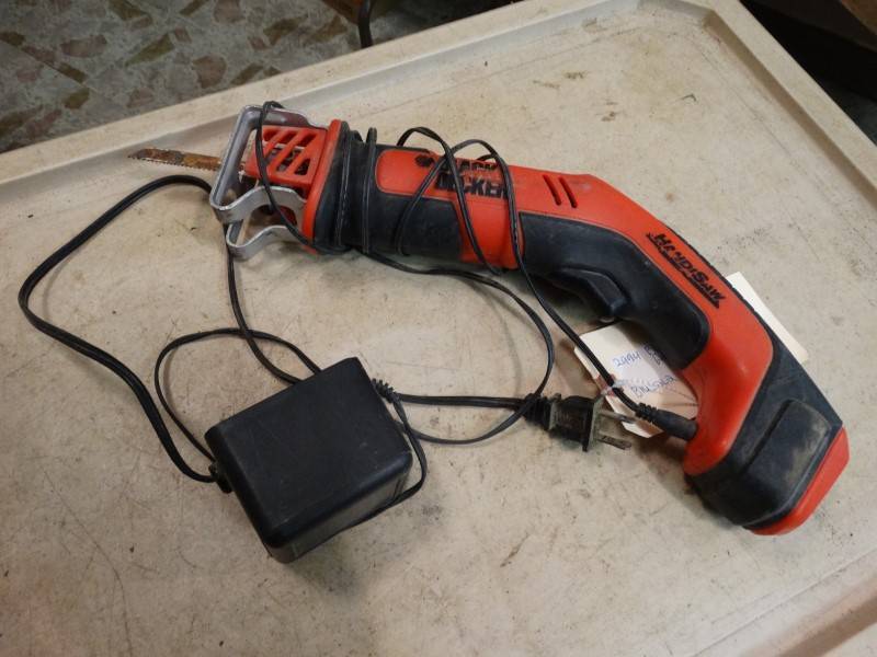 lot 2214 image: Black &amp Decker Cordless Jigsaw With Charger -Charged And Working