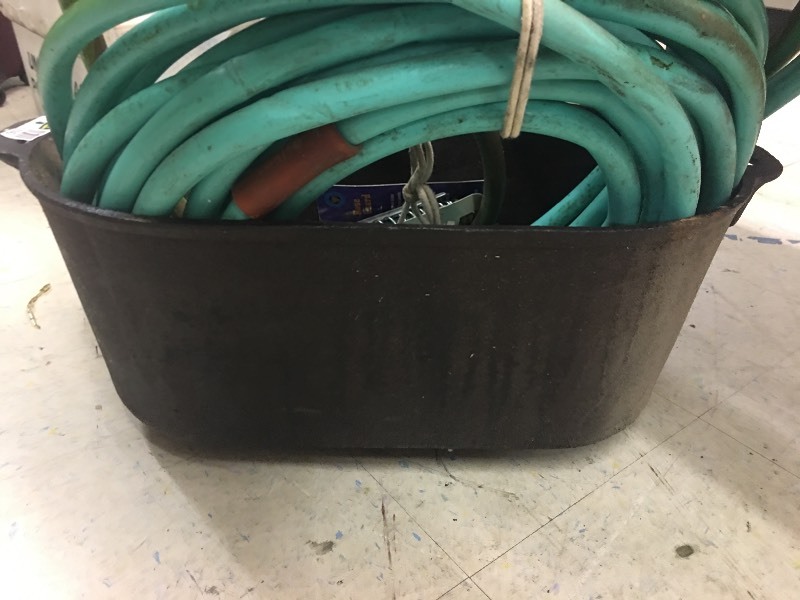lot 12042 image: Cast Iron Pot & Water Hoses