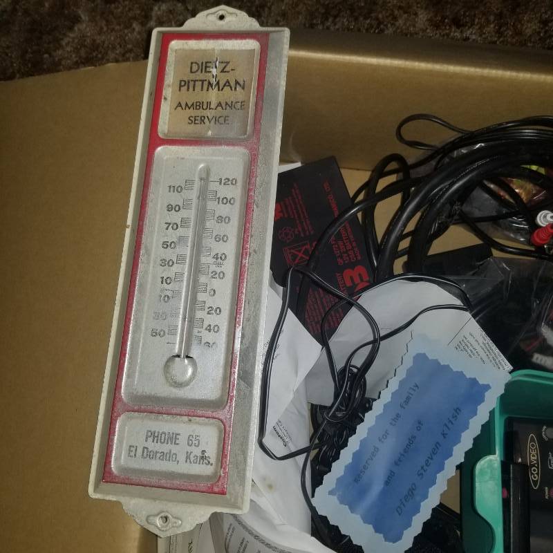 lot 12183 image: Vintage Outdoor Thermometer Advertising El Dorado Ambulance, Remotes, Surge Protectors