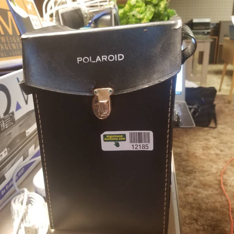 lot 12185 image: Big Shot Polaroid Land Camera, One Magicube attached and one in a box.