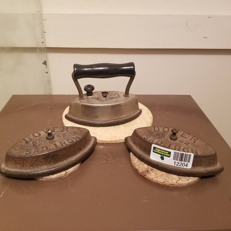 lot 12204 image: Three Vintage Dover Sad Iron No. 62 Cast Iron Ironing Metal