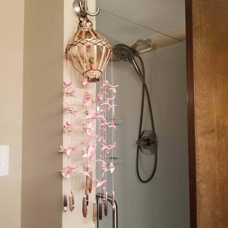 lot 12247 image: Decorative Faux Birdcage with Shells, Trashcan, Candle, Cleaning Supplies, Belkin Battery Backup