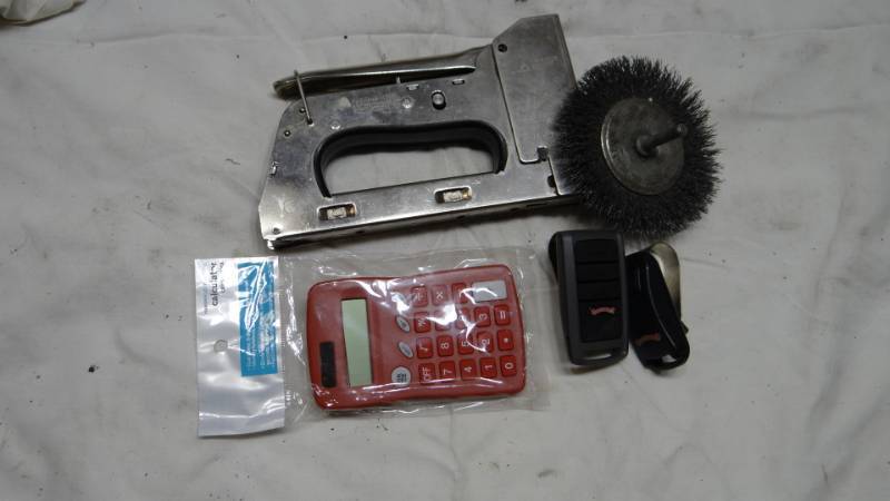 lot 4136 image: Garage Door Remotes with Bonus Staple Gun and More