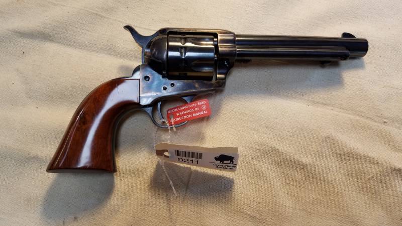 lot 9211 image: Uberti .22lr Handgun - Single Action Cowboy Style.  LOOK AT IT  We arent saying its new, but we sure didnt put that red factory Before Using sticker on the trigger guard  It sure likes new to us