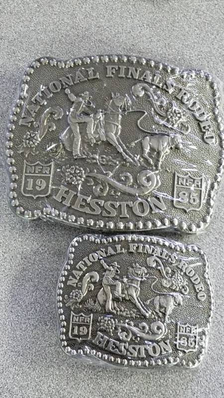 lot 1290 image: 2 Hesston Belt Buckles, Large and Small